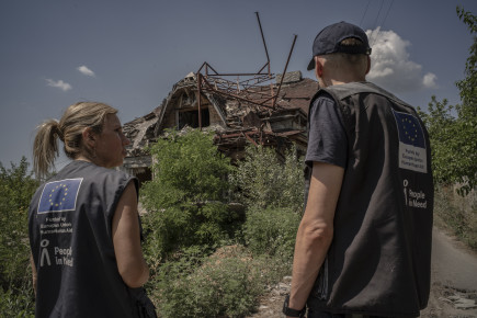 Repairing Houses in a War-Torn Village