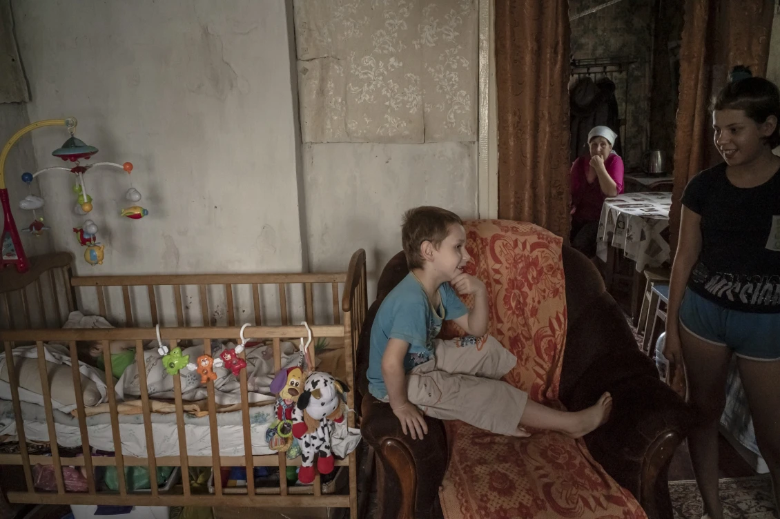 The older children wait until their younger sister wakes up to go for a walk