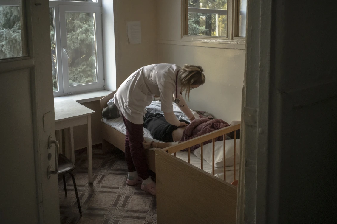 A doctor examines one of the young patients at the Sloviansk Regional Children's Hospital. This hospital receives children from all over the oblast. 