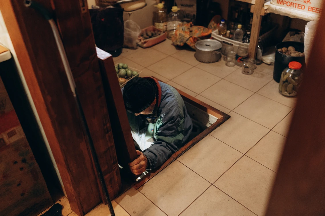 Anatolii goes down to the basement, where he and his wife hid from the explosions.
