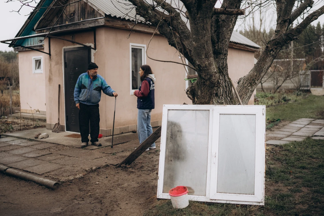 We installed the door behind Anatoliy. We also replaced the damaged windows and roof. 