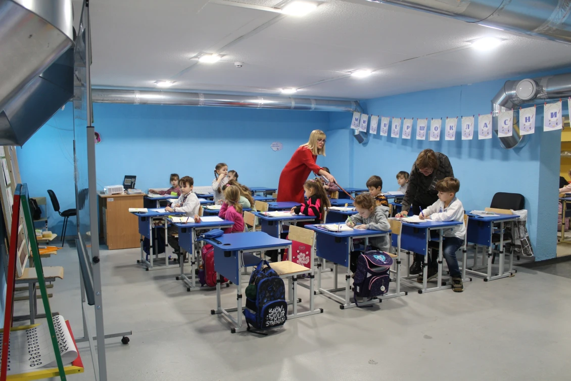 First grade students during a lesson at the shelter