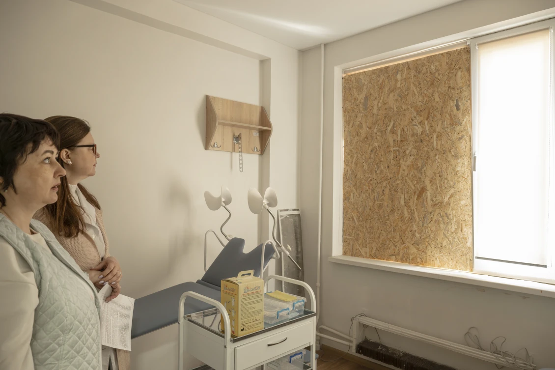 The Kharkiv Polyclinic No. 21 staff show the windows that were blown out due to the strike. This facility serves more than 19,000 residents. 