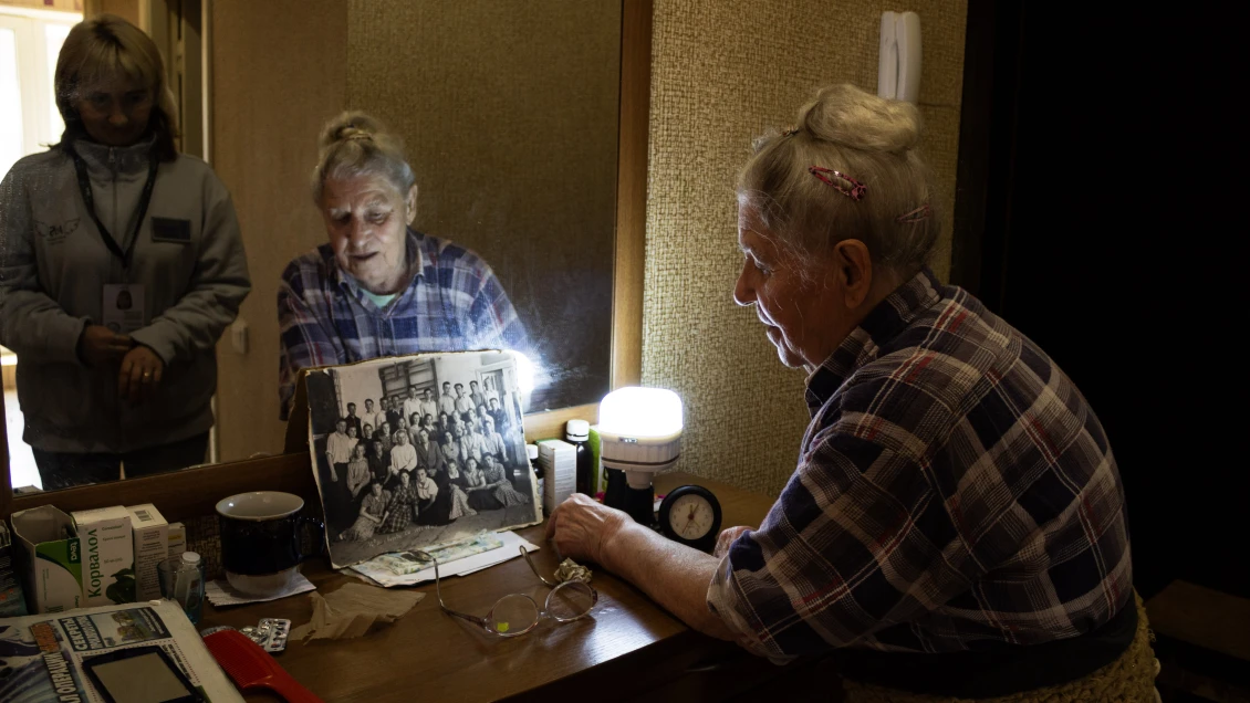 Belongings, furniture, dishes–there are practically no personal items in the rented flat. However, Valentyna has kept her old photos 