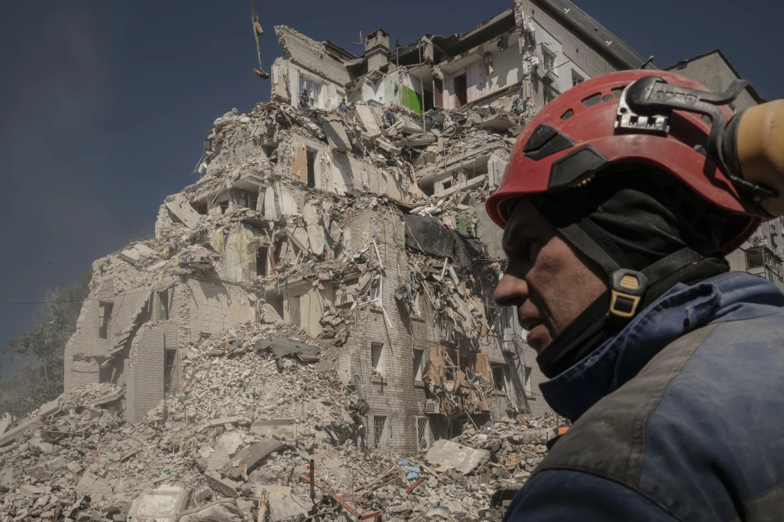 Rescue workers are continuing to clear the rubble from residential buildings