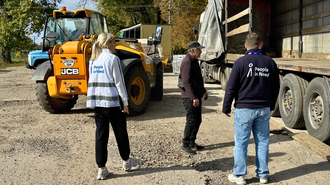 Unloading fuel briquettes, Sumy Oblast